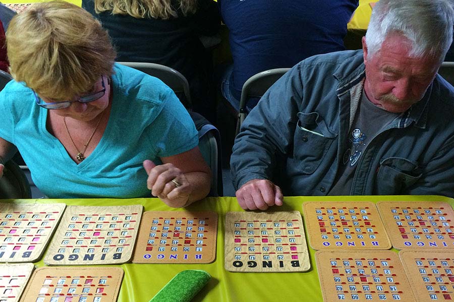 man and woman playing bingo