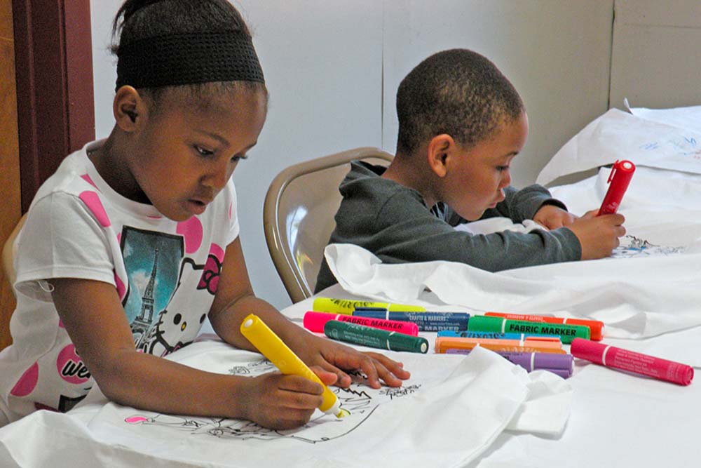 kids coloring with markers